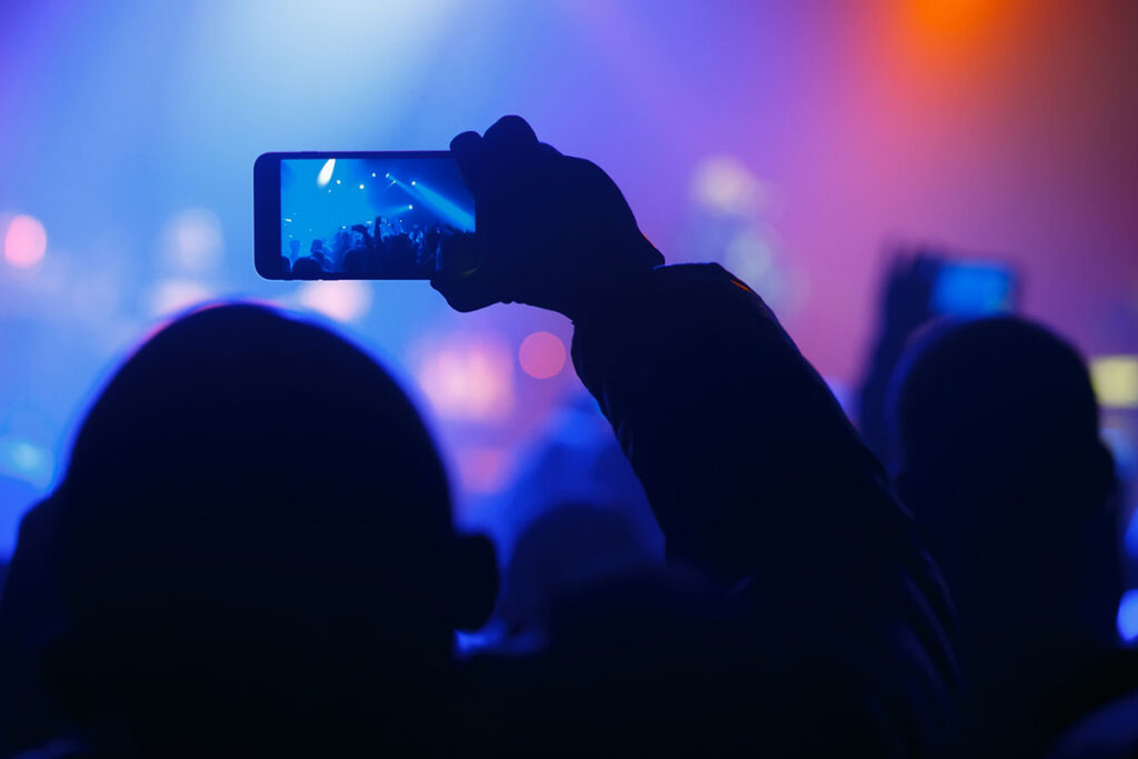 ebook-top-trends_people-at-concert-with-cellphone